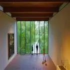 An Art Gallery with a Window Overlooking a Lake