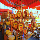 A Street Market in Zagreb with Wheels of Cheese