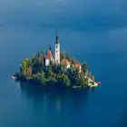 A Small Island with a Church on it in the Middle of Lake Bled