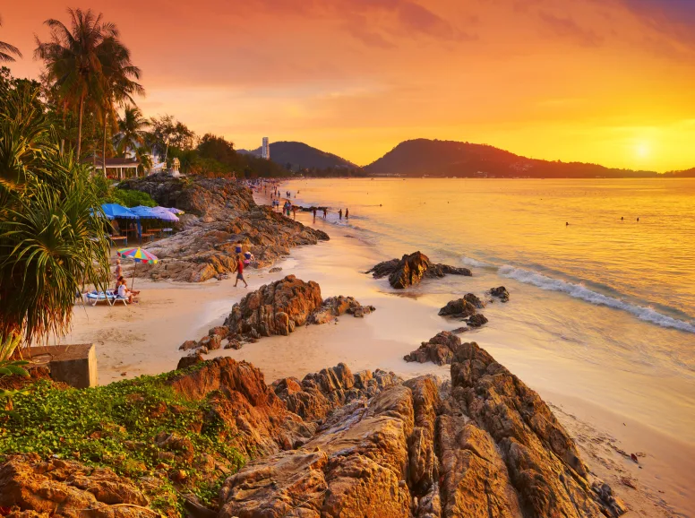 Golden Sun Saturates a White Sandy Beach in Phuket
