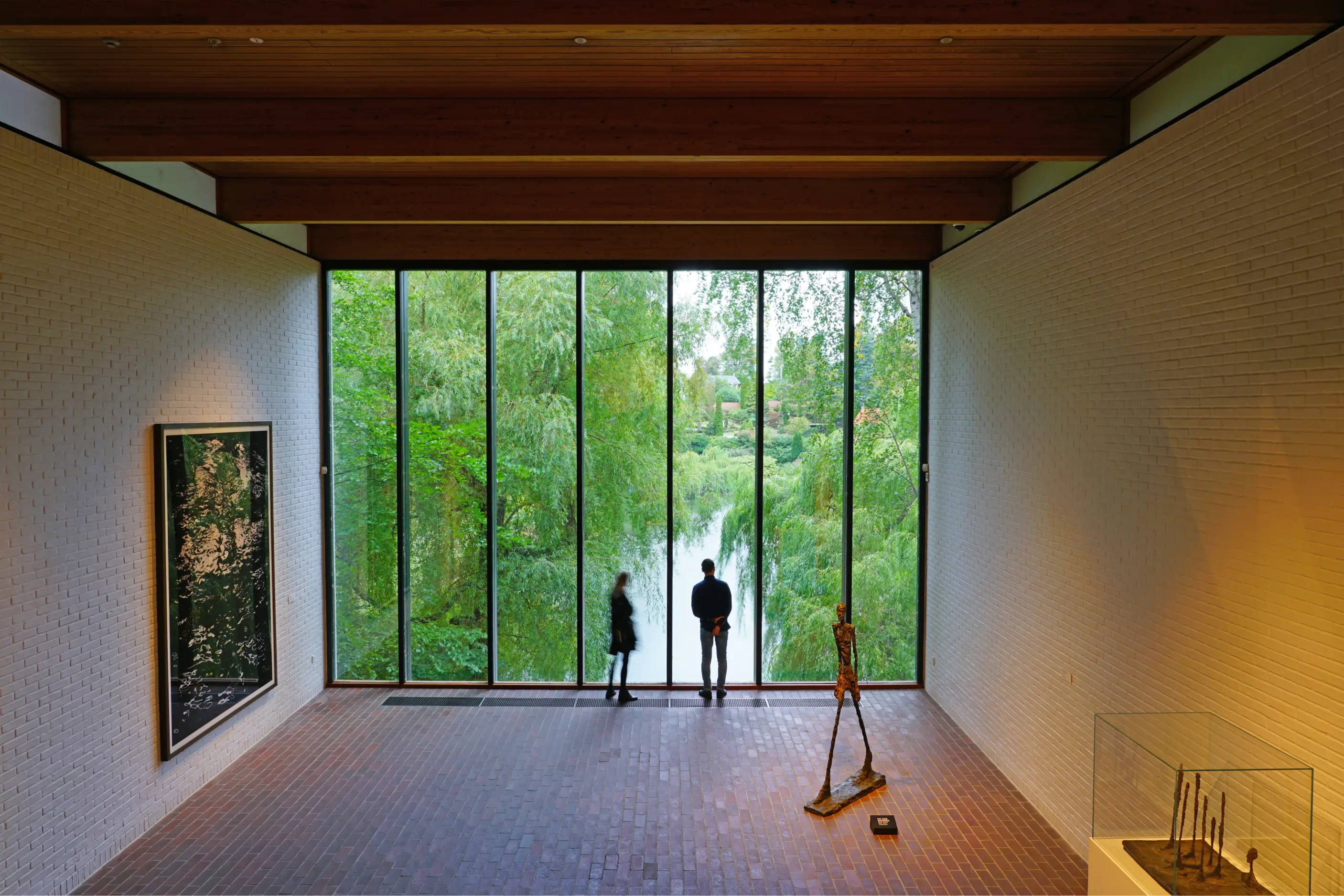 An Art Gallery with a Window Overlooking a Lake