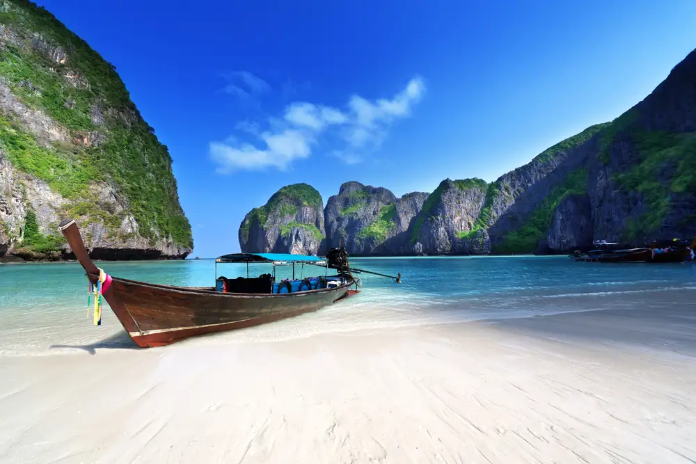 A Traditional Thai Wooden Longtail Boat in one of the Phi Phi Islands