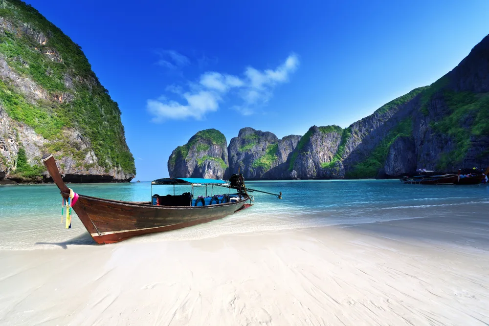 A Traditional Thai Wooden Longtail Boat in one of the Phi Phi Islands