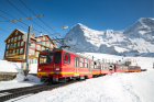 Red Train Through Snowy Jun Jungfraujoch