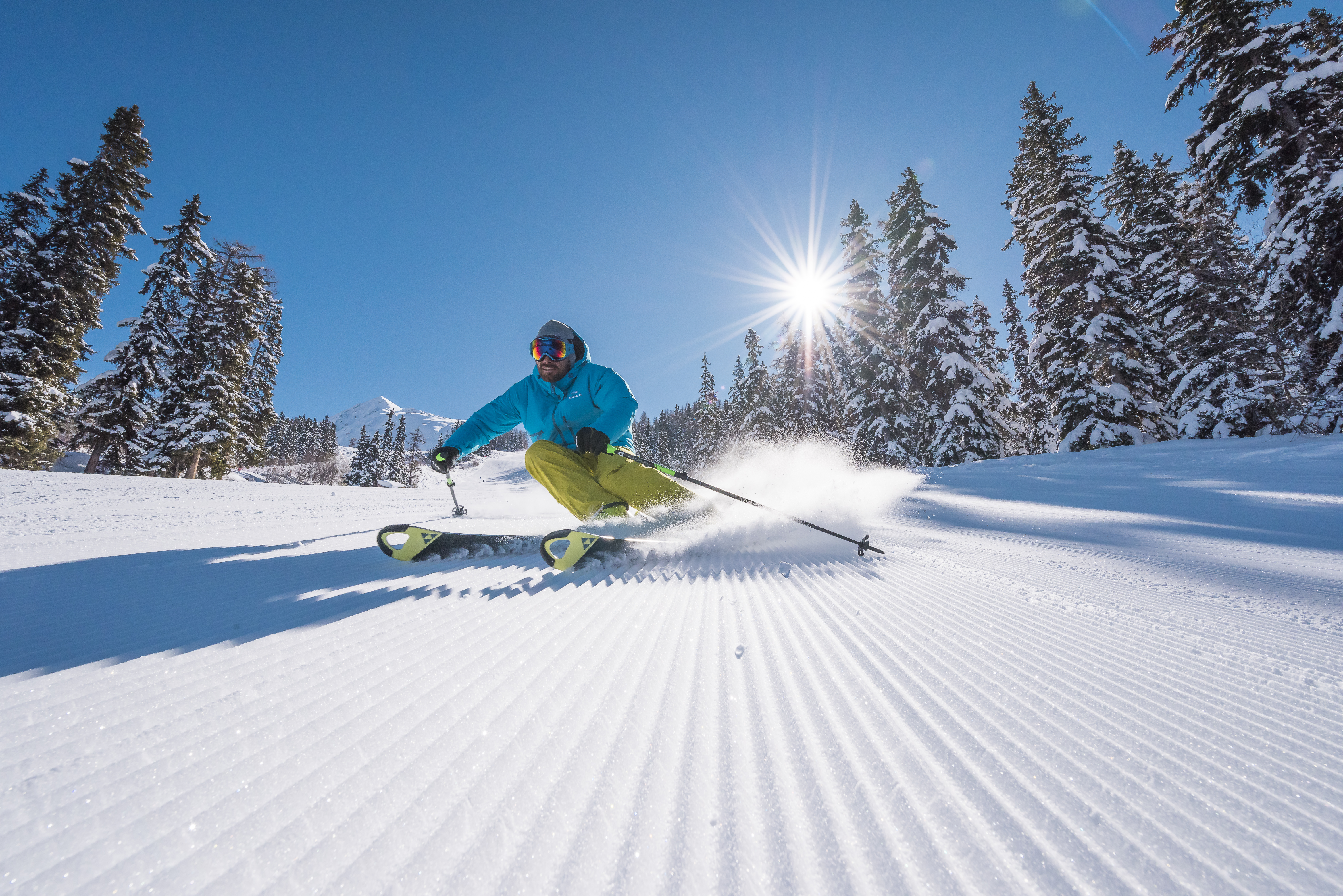 Skier enjoying fresh powder on empty slopes