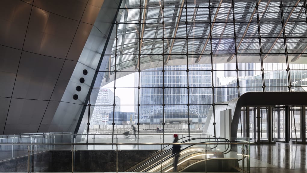 View of a man coming up on an escalator inside the CITIC Tower in Beijing
