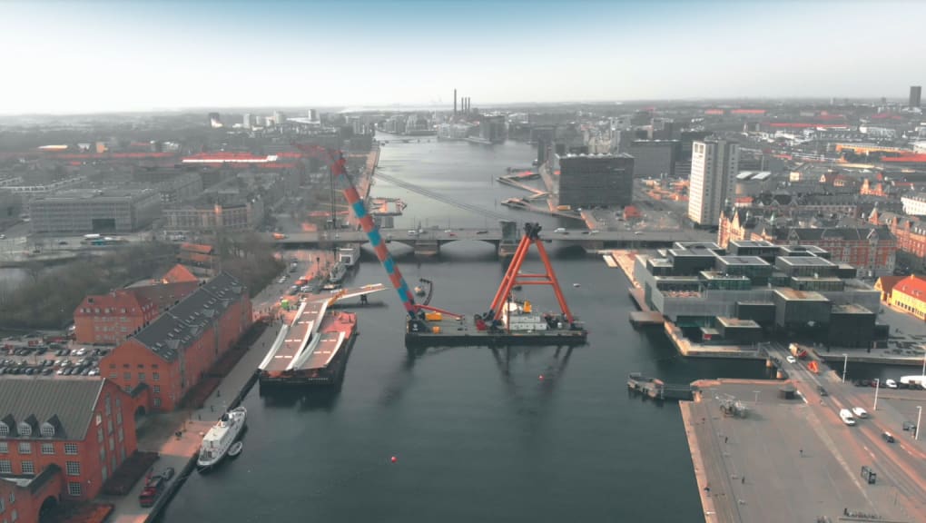 Wide aerial day time view of the Lille Langebro Bridge being constructed
