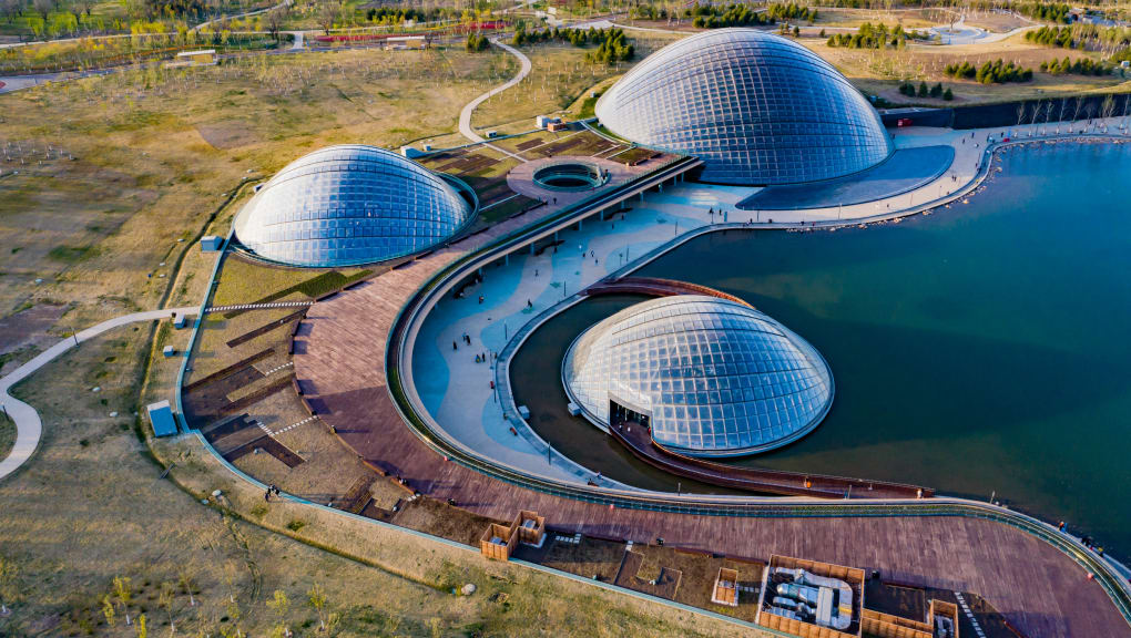 Aerial day time shot of the three Inside shot of the roof and trees within the Water side shot of the Close up of the  Wide aerial day time shot of the Taiyuan botanical garden domes