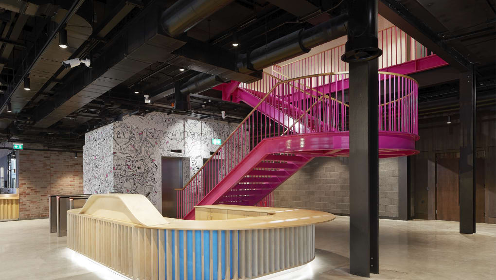 Interior view of a pink staircase at Brixton House