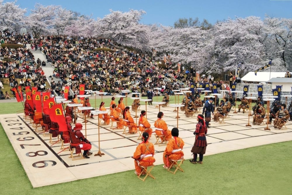 Local high school students perform Ningen Shogi, human Japanese chess on  top of Mt. Maizuru, in Tendo, Yamagata Prefecture on April 22, 2017. Tendo  is known for production of shogi koma,'' pieces