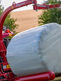 Round Bale Wrappers - Kverneland 7820, gently self-loading system and can wrap on the move so it operates effectively