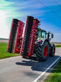 Kverneland F35 compact travelling on road with tractor