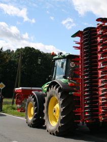 Kverneland F35 compact travelling on road with tractor