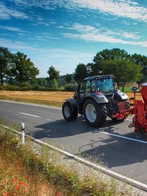 Kverneland U-drill, transported on road by tractor