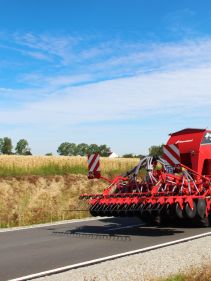 Kverneland U-drill, transported on road by tractor