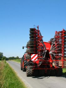 Kverneland U-drill, transported on road by tractor