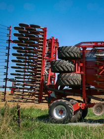 Kverneland U-drill, transported on road by tractor