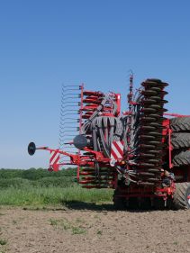 Kverneland U-drill, transported on road by tractor