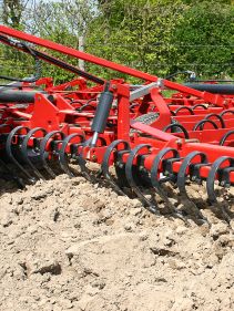 Seedbed Cultivators - Kverneland TLF performs precise depth control during operation on field