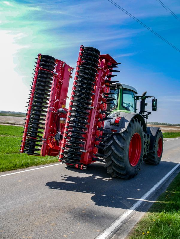 Kverneland F35 compact travelling on road with tractor