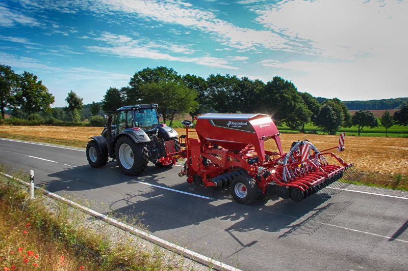 Kverneland U-drill, transported on road by tractor