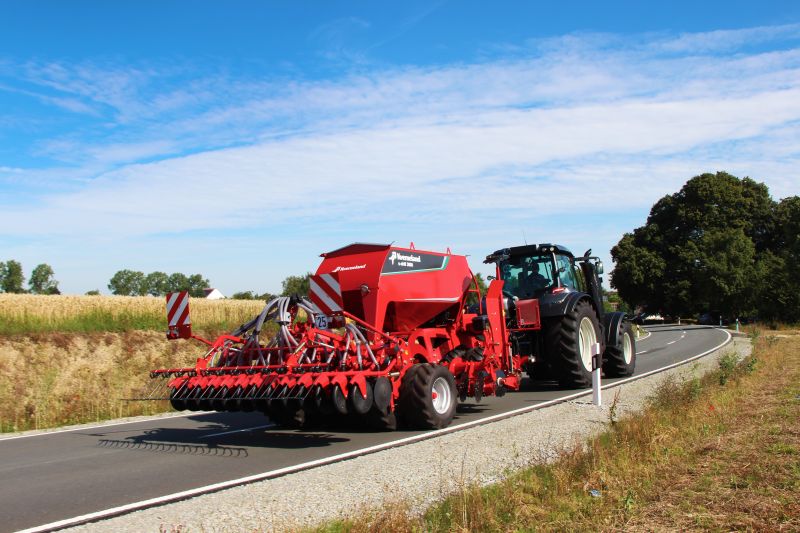 Kverneland U-drill, transported on road by tractor