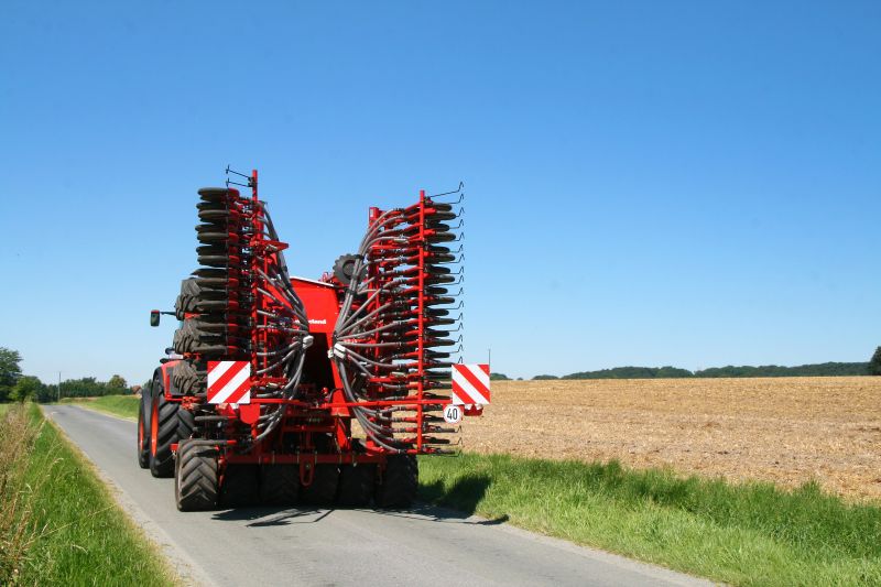 Kverneland U-drill, transported on road by tractor