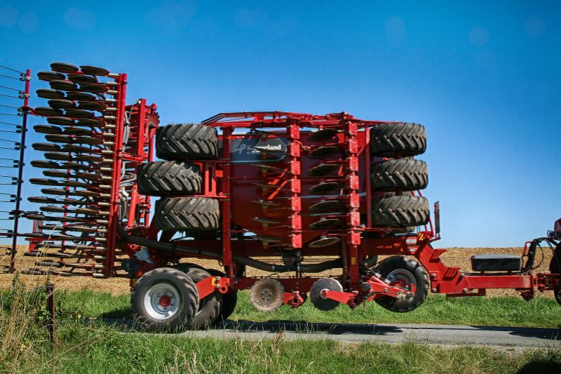 Kverneland U-drill, transported on road by tractor