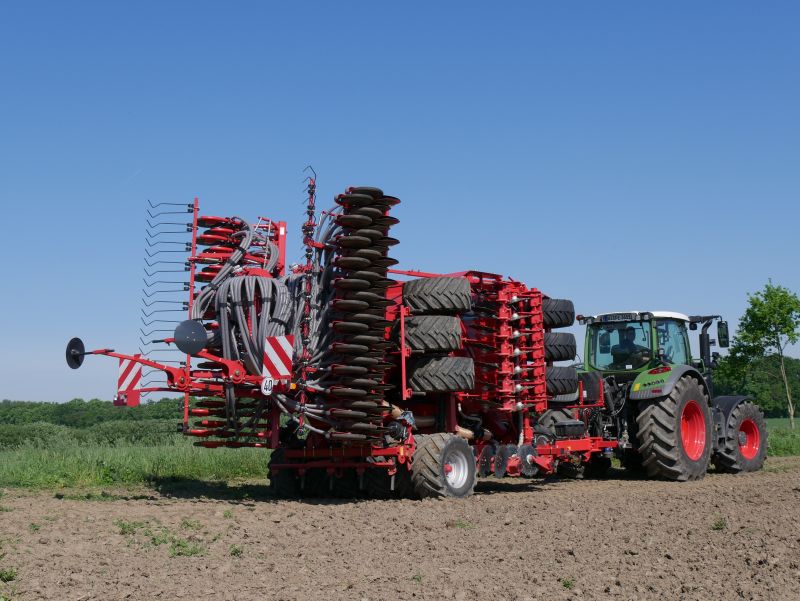 Kverneland U-drill, transported on road by tractor