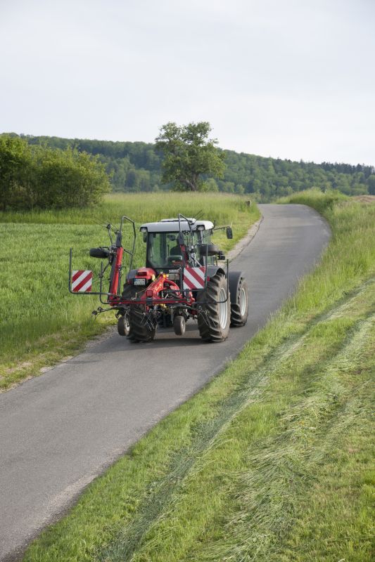 Mounted Tedders - VICON FANEX 464 - 524T - 524, folded and transported safe and efficient by tractor