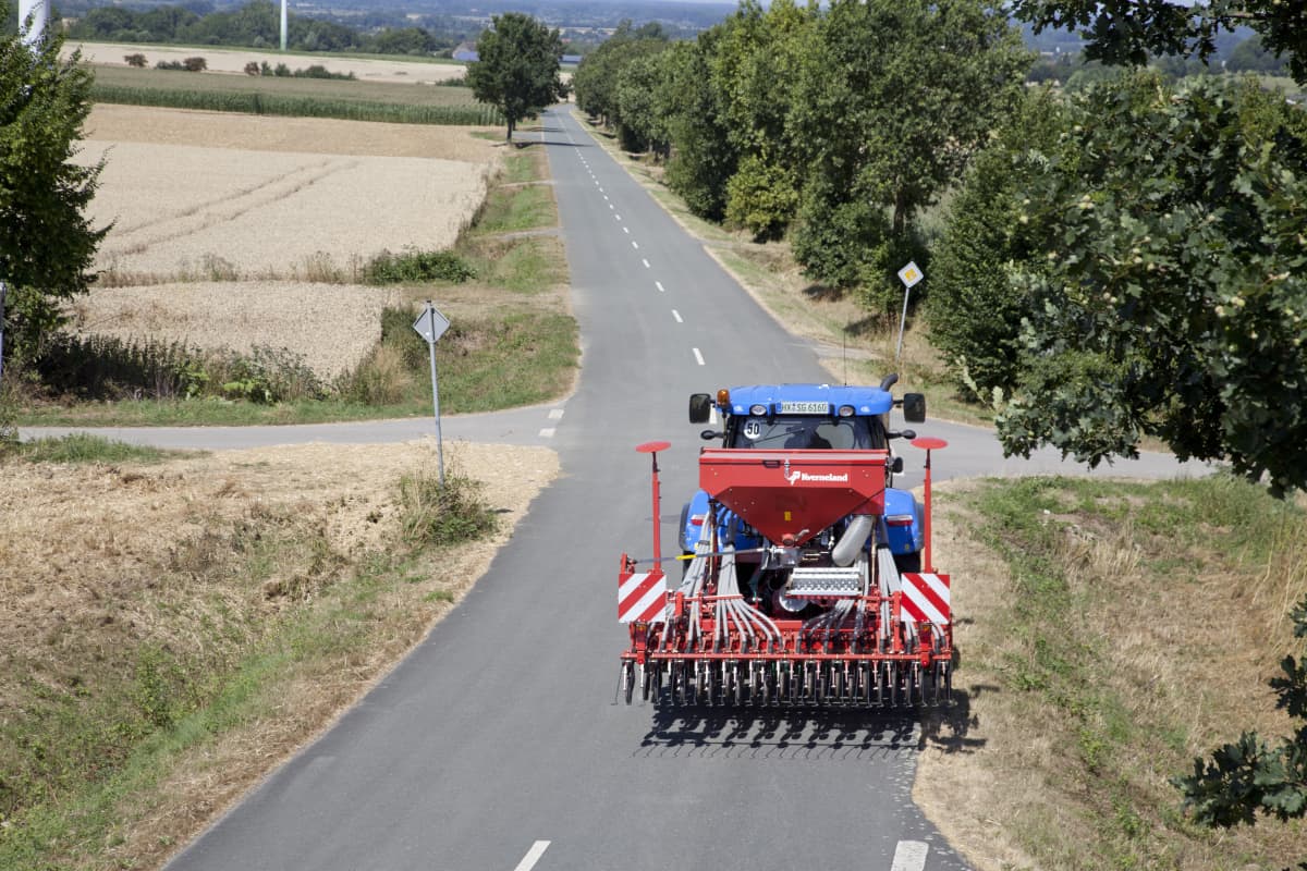 Kverneland S-Drill transported on road by tractor