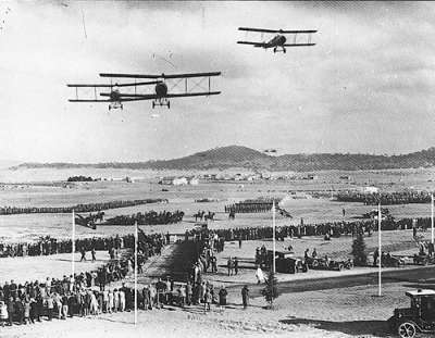 Air Force and civilian aircraft fly over the royal entourage at the opening in 1927.