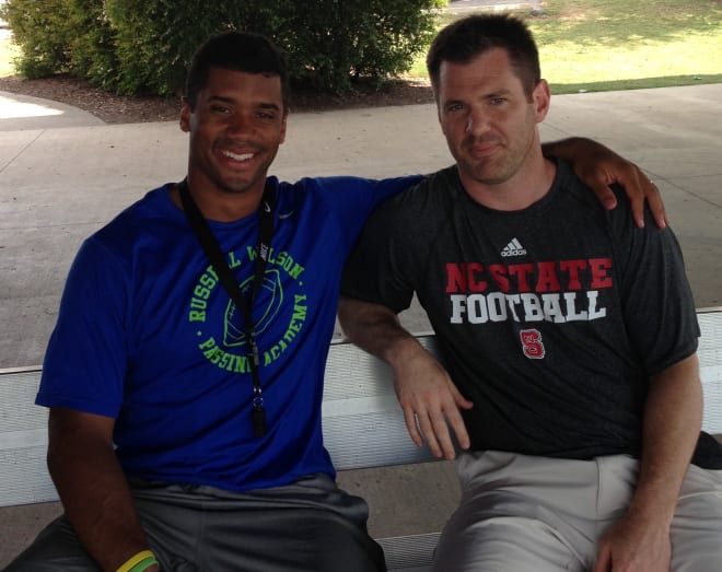 Former NC State Wolfpack football quarterback Russell Wilson with Chad Jamison.