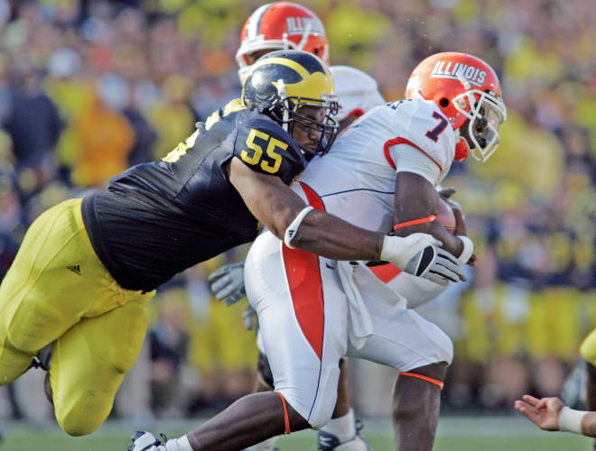 Michigan Wolverines football defensive end Brandon Graham sacks the QB.