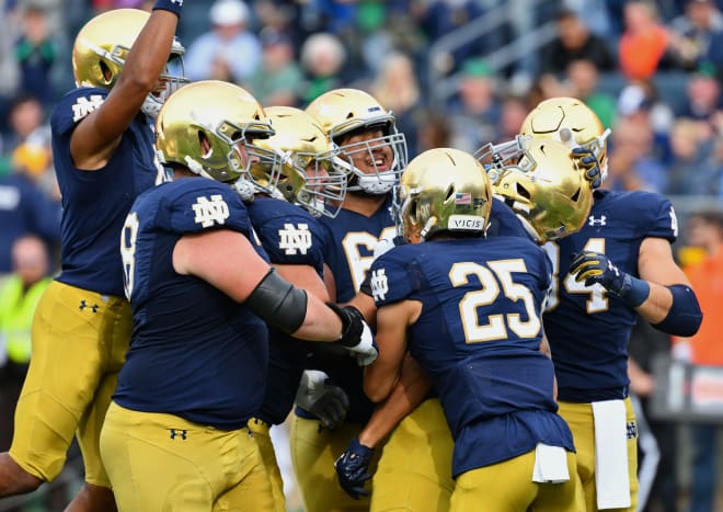 Notre Dame Fighting Irish football players celebrating