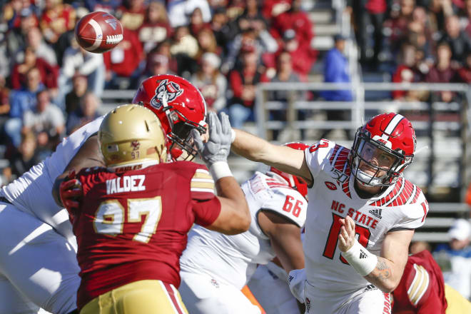 NC State Wolfpack football quarterback Devin Leary throws a pass.