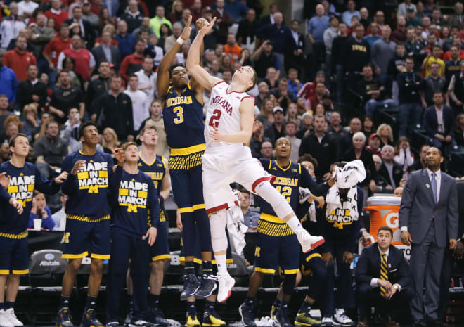 Michigan Wolverines basketball's Kam Chatman drains a three.