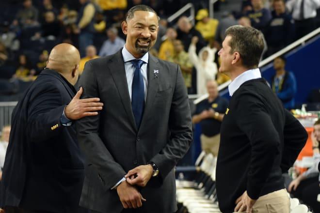 Michigan Wolverines AD Warde Manuel (far left), Juwan Howard (middle) and Jim Harbaugh