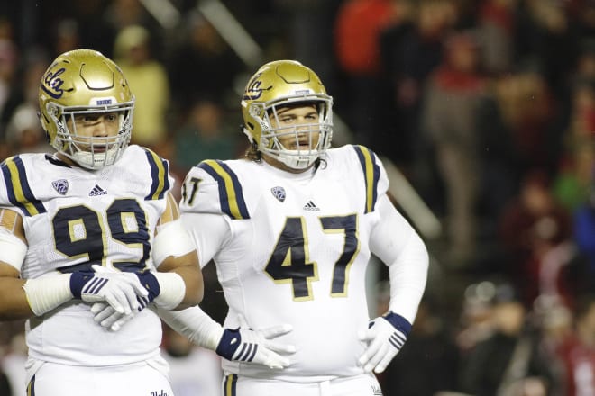 Former UCLA defenders Matt Dickerson and Eddie Vanderdoes