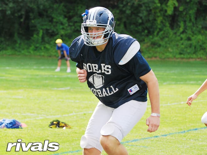 New England offensive lineman Drew Kendall holds a Michigan Wolverines football recruiting offer Jim Harbaugh. 