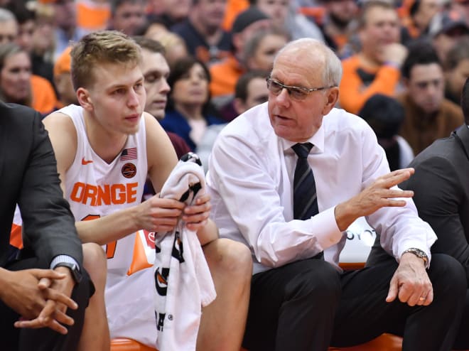 Syracuse head coach Jim Boeheim, who is talking to junior power forward Marek Dolezaj, and the Orange host NC State at 7 p.m. Tuesday.