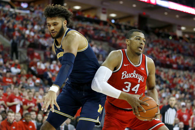 Ohio State center Kaleb Wesson grabs rebounds over Michigan forward Isaiah Livers