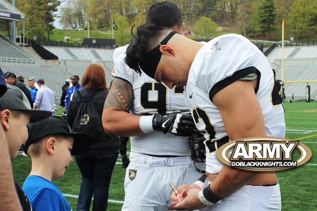 Calen Holt signing autographs for the young Army football fans