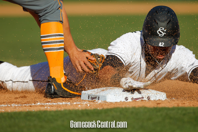 Dom Thompson-Williams slides into third during Saturday's game.