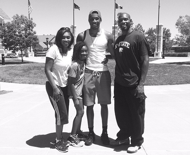 Sneed poses with his family after officially arriving on campus in Manhattan.