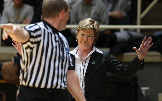 Pat Summitt, who died on Tuesday at the age of 64, brushes off an official during Tennessee's NCAA Tournament win over Purdue in Mackey Arena in 2008.