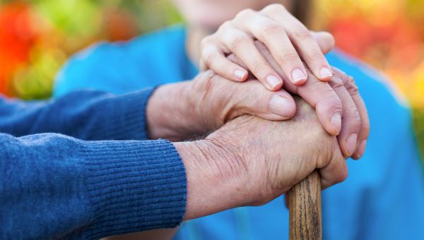 old couple holding hands