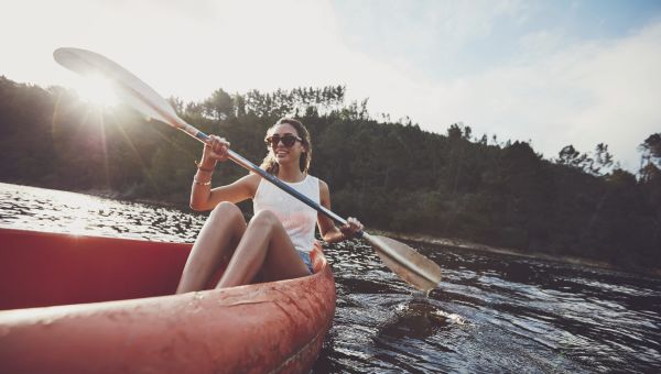 woman rowing in a canoe
