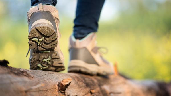 feet walking across a log