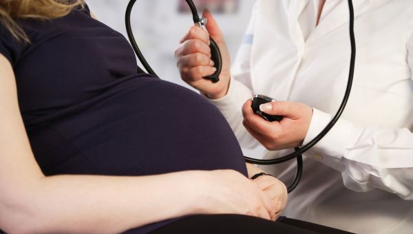 pregnant person, doctor, stethoscope, parent to be